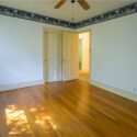 A bedroom with animal theme wallpaper trim