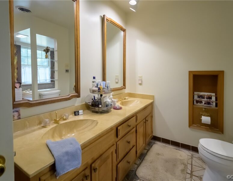 A bathroom with double sinks