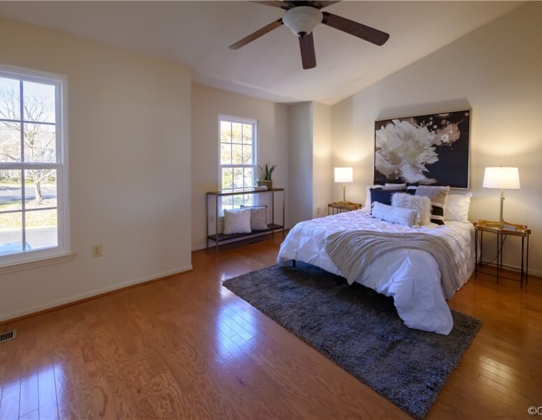 A master bedroom with luxurious bedding